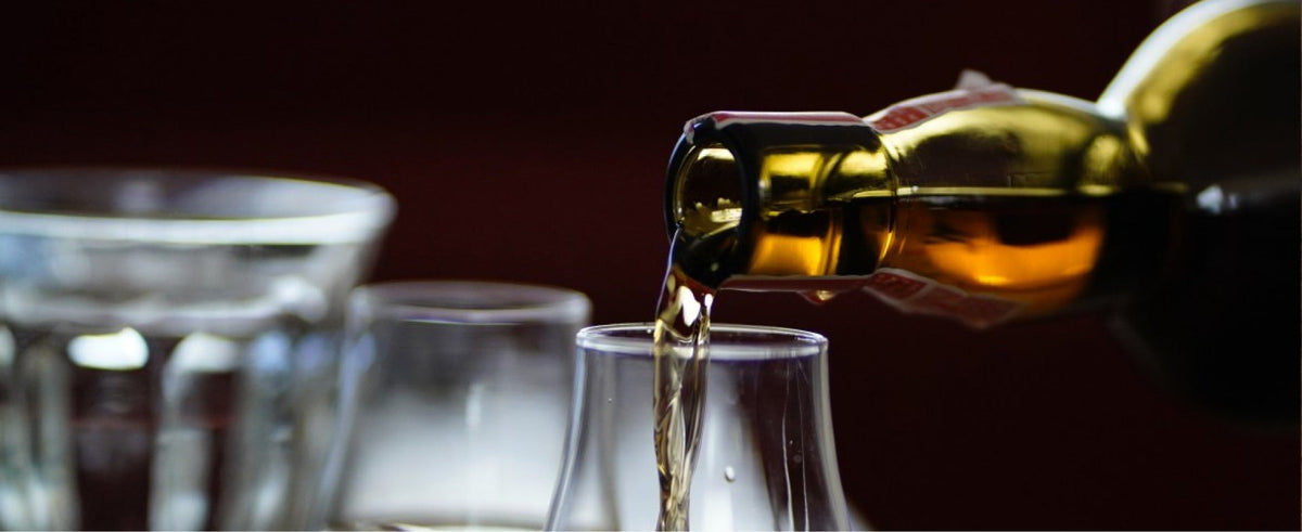 Whiskey pouring into a glass